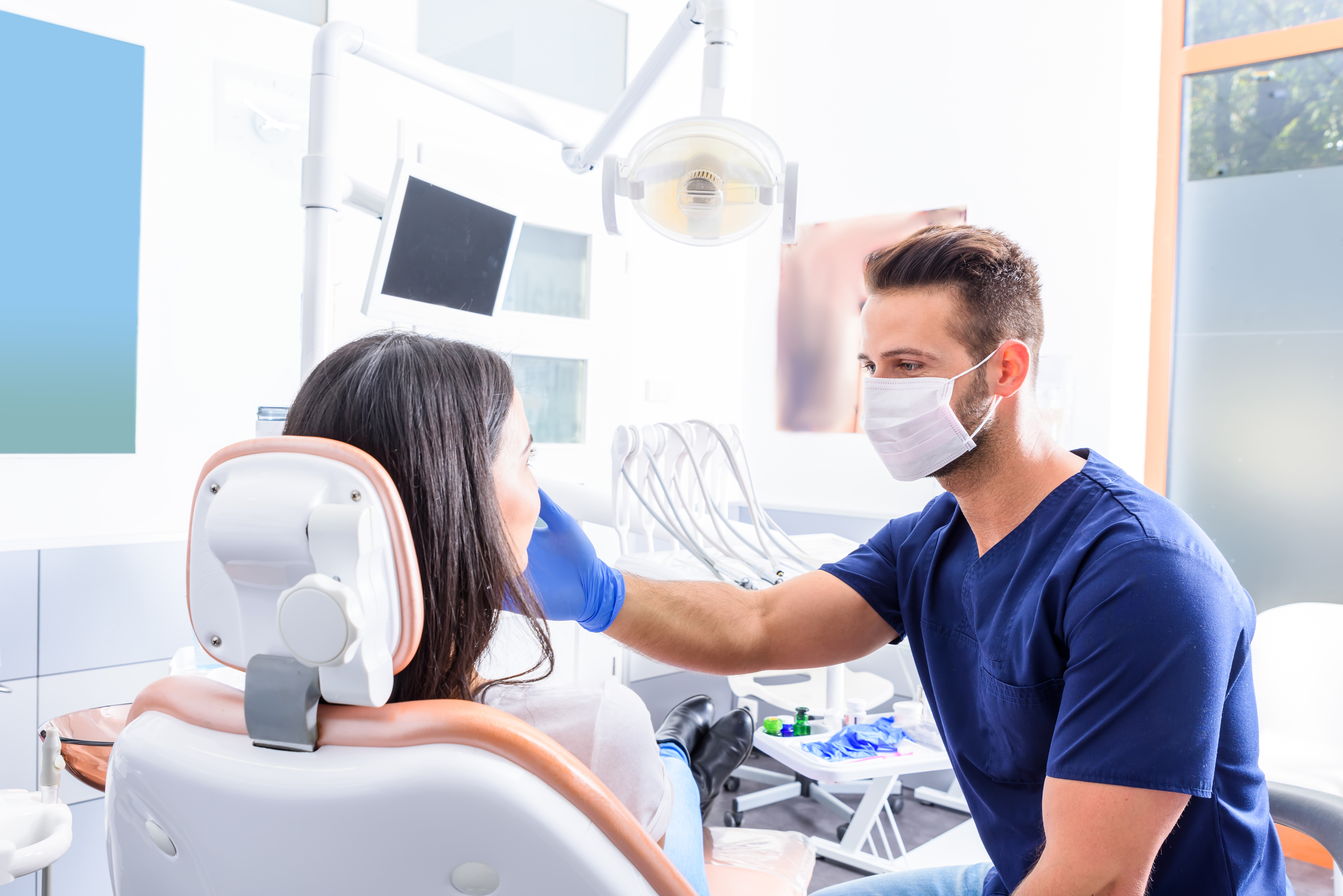 Orthodontist treating young patient