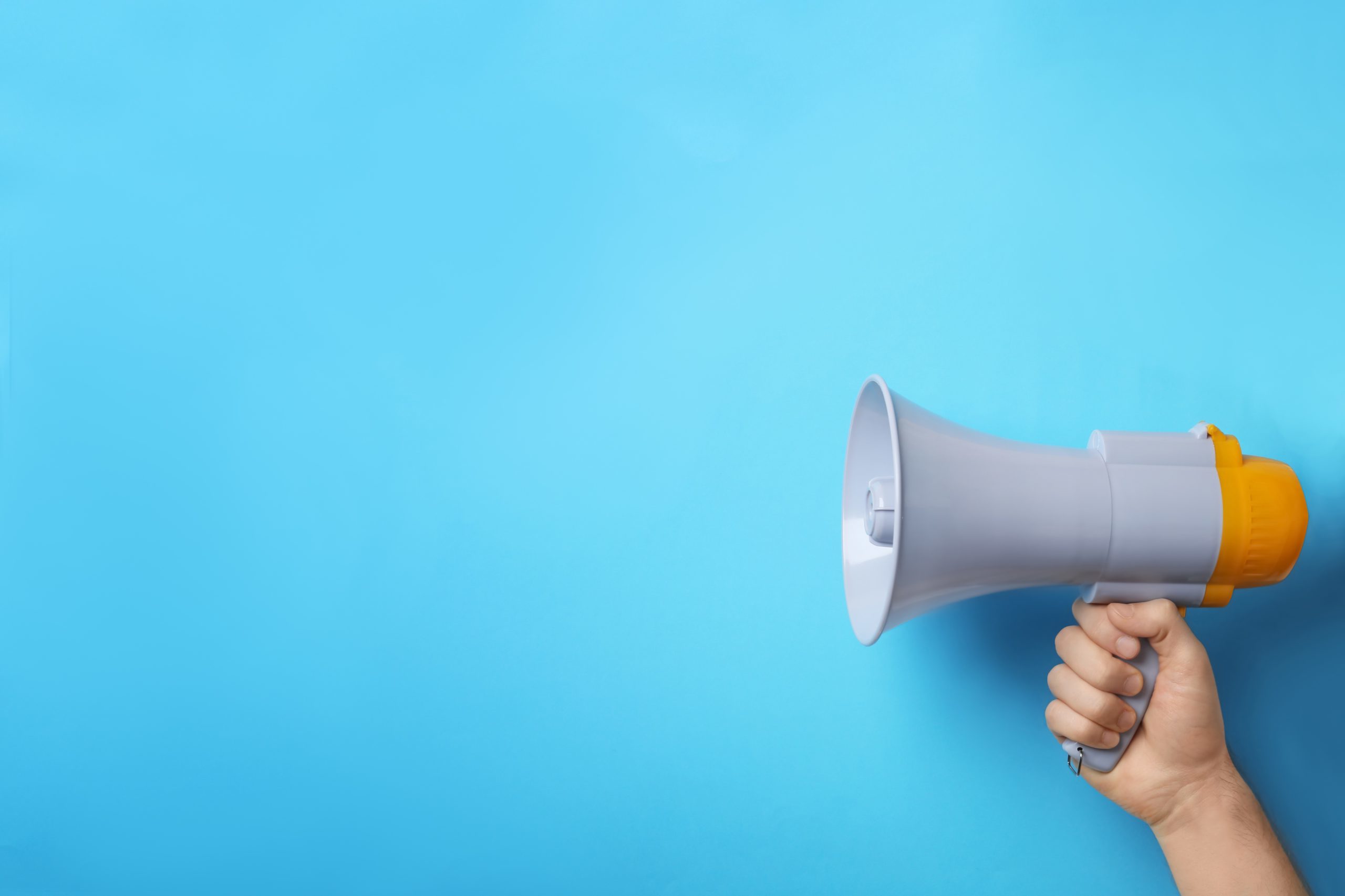 Image of a person holding a megaphone.
